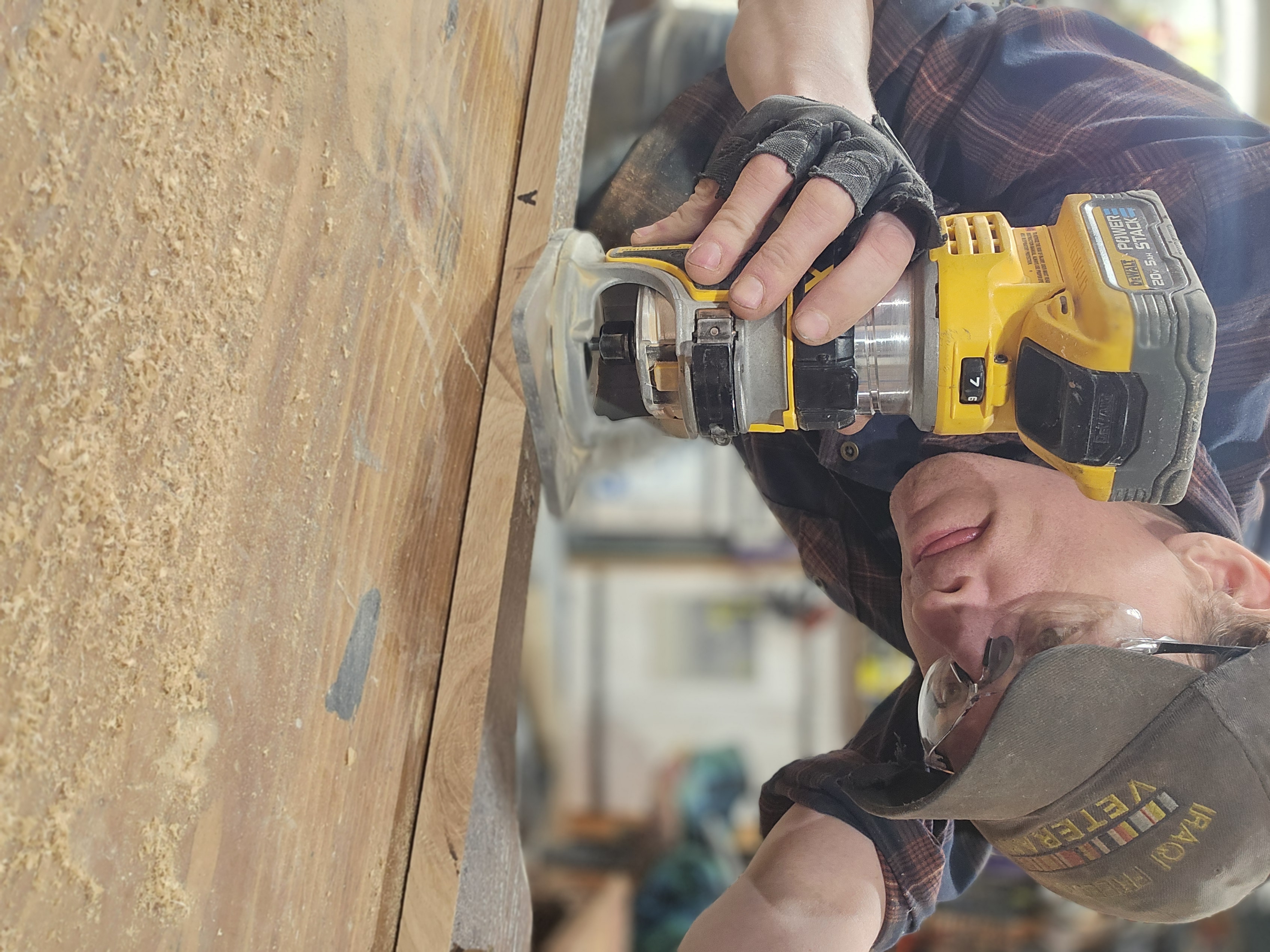 Wade working in the shop aligning wood